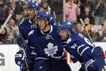 TORONTO - OCTOBER 2: Kris Versteeg #32, Tyler Bozak #42 and Phil Kessel #81 of the Toronto Maple Leafs celebrate a goal by teammate Tomas Kaberle #15 against the Detroit Red Wings during a preseason NHL game at the Air Canada Centre October 2, 2010 in Toronto, Ontario, Canada. (Photo by Abelimages/Getty Images)