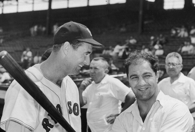 BOSTON - CIRCA 1955:  (UNDATED FILE PHOTO) Baseball legend Ted Williams (1918 - 2002) of the Boston Red Sox (L) laughs as American boxing great Rocky Marciano (1923 - 1969) swings a bat circa 1955. The 83-year-old Williams, who was the last major league player to bat .400 when he hit .406 in 1941, died July 5, 2002 at Citrus County Memorial Hospital in Florida. He died of an apparent heart attack.  (Photo by Getty Images)