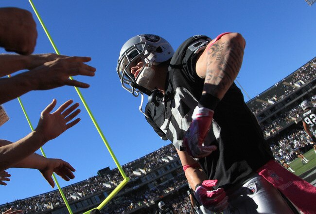 OAKLAND, CA - OCTOBER 10:  Nick Miller #89 of the Oakland Raiders high fives fans before their game against the San Diego Chargers at Oakland-Alameda County Coliseum on October 10, 2010 in Oakland, California.  (Photo by Ezra Shaw/Getty Images)