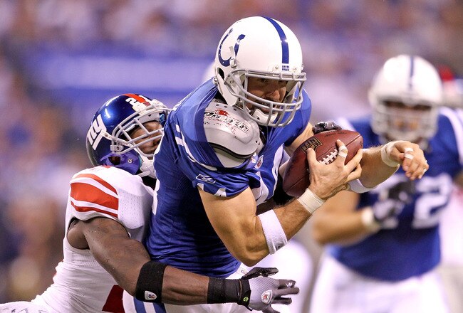 INDIANAPOLIS - SEPTEMBER 19: Dallas Clark #44  of the Indianapolis Colts catches a pass while defended by Kenny Phillips #21 of the New York Giants during the NFL game at Lucas Oil Stadium on September 19, 2010 in Indianapolis, Indiana.  (Photo by Andy Lyons/Getty Images)