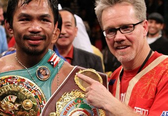 LAS VEGAS - NOVEMBER 14:  Manny Pacquiao celebrates his 12 round TKO victory against Miguel Cotto with trainer Freddy Roach during their WBO welterweight title fight at the MGM Grand Garden Arena on November 14, 2009 in Las Vegas, Nevada.  (Photo by Al Bello/Getty Images)