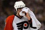 PITTSBURGH - MAY 11:  Braydon Coburn #5 of the Philadelphia Flyers skates off the ice holding a towel over his injury during the first period of game two of the Eastern Conference Finals of the 2008 NHL Stanley Cup Playoffs against the Pittsburgh Penguins at Mellon Arena on May 11, 2008 in Pittsburgh, Pennsylvania.  (Photo by Jim McIsaac/Getty Images)