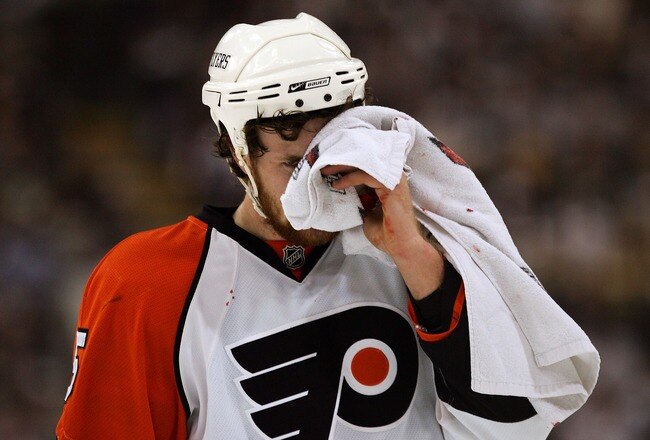 PITTSBURGH - MAY 11:  Braydon Coburn #5 of the Philadelphia Flyers skates off the ice holding a towel over his injury during the first period of game two of the Eastern Conference Finals of the 2008 NHL Stanley Cup Playoffs against the Pittsburgh Penguins at Mellon Arena on May 11, 2008 in Pittsburgh, Pennsylvania.  (Photo by Jim McIsaac/Getty Images)