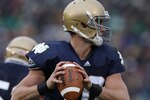 SOUTH BEND, IN - SEPTEMBER 25: Dayne Crist #10 of the Notre Dame Fighting Irish looks for a receiver against the Stanford Cardinal at Notre Dame Stadium on September 25, 2010 in South Bend, Indiana. Stanford defated Notre Dame 37-14.  (Photo by Jonathan Daniel/Getty Images)