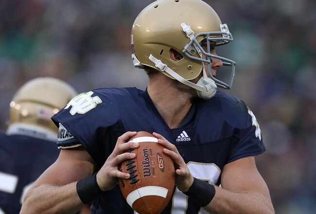 SOUTH BEND, IN - SEPTEMBER 25: Dayne Crist #10 of the Notre Dame Fighting Irish looks for a receiver against the Stanford Cardinal at Notre Dame Stadium on September 25, 2010 in South Bend, Indiana. Stanford defated Notre Dame 37-14.  (Photo by Jonathan Daniel/Getty Images)