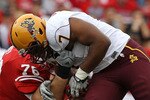 MADISON, WI - SEPTEMBER 18: John Clay #32 of the Wisconsin Badgers is tackled by the fask mask by Vontaze Burfict #7 of the Arizona State Sun Devils at Camp Randall Stadium on September 18, 2010 in Madison, Wisconsin. (Photo by Jonathan Daniel/Getty Images)
