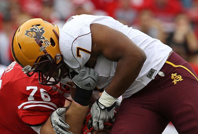 MADISON, WI - SEPTEMBER 18: John Clay #32 of the Wisconsin Badgers is tackled by the fask mask by Vontaze Burfict #7 of the Arizona State Sun Devils at Camp Randall Stadium on September 18, 2010 in Madison, Wisconsin. (Photo by Jonathan Daniel/Getty Images)