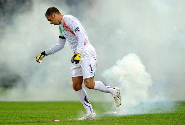 GENOA, ITALY - OCTOBER 12:  Emiliano Viviano of Italy avoids missiles thrown onto the pitch during the UEFA Euro 2012 qualifying match between Italy and Serbia at Luigi Ferraris Stadium on October 12, 2010 in Genoa, Italy.  (Photo by Claudio Villa/Getty Images)