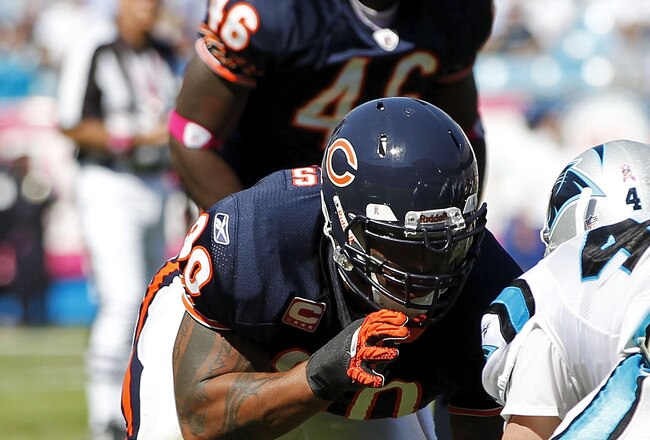 CHARLOTTE, NC - OCTOBER 10: Defensive end Julius Peppers #90 of the Chicago Bears lines up against tight end Jeff King #47 of the Carolina Panthers at Bank of America Stadium on October 10, 2010 in Charlotte, North Carolina. (Photo by Geoff Burke/Getty Images)