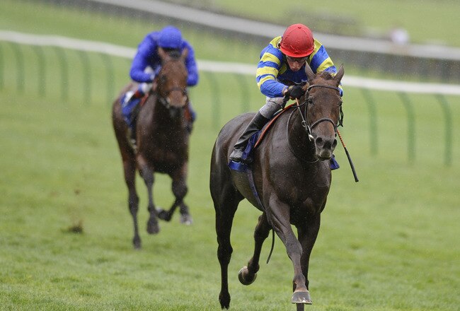 NEWMARKET, ENGLAND - OCTOBER 01: William Buick riding Myplacelater win The Aqlaam Godolphin Stakes at Newmarket racecourse on October 01, 2010 in Newmarket, England  (Photo by Alan Crowhurst/ Getty Images)