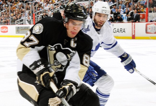 PITTSBURGH - OCTOBER 13:  Sidney Crosby #87 of the Pittsburgh Penguins attempts to regain control of the puck against the Toronto Maple Leafs on October 13, 2010 at Consol Energy Center in Pittsburgh, Pennsylvania.  (Photo by Jamie Sabau/Getty Images)