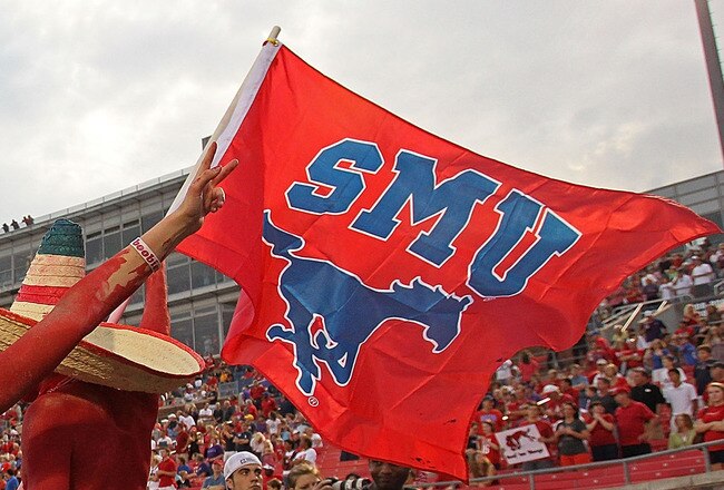 DALLAS - SEPTEMBER 24:  Fans of the SMU Mustangs wave a flag before a game against the TCU Horned Frogs at Gerald J. Ford Stadium on September 24, 2010 in Dallas, Texas.  (Photo by Ronald Martinez/Getty Images)