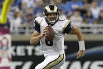 DETROIT - OCTOBER 10: Sam Bradford #8 of the St. Louis Rams roles out to pass during the first quarter of the game against the Detroit Lions at Ford Field on October 10, 2010 in Detroit, Michigan.  (Photo by Leon Halip/Getty Images)