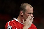 MANCHESTER, ENGLAND - SEPTEMBER 14:  Wayne Rooney of Manchester United reacts after team mate Antonio Valencia is injured during the UEFA Champions League Group C match between Manchester United and Rangers at Old Trafford on September 14, 2010 in Manchester, England.  (Photo by Alex Livesey/Getty Images)