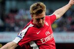 LONDON, ENGLAND - APRIL 24:  Nicklas Bendtner of Arsenal crosses the ball during the Barclays Premier League match between Arsenal and Manchester City at the Emirates Stadium on April 24, 2010 in London, England.  (Photo by Shaun Botterill/Getty Images)