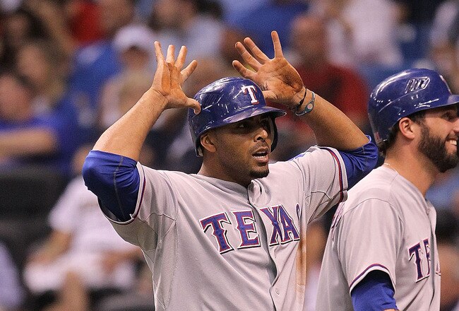 ST. PETERSBURG, FL - OCTOBER 12:  Nelson Cruz #17 of the Texas Rangers gives the deer horns after scoring on a throwing error by catcher Kelly Shoppach during Game 5 of the ALDS at Tropicana Field on October 12, 2010 in St. Petersburg, Florida.  (Photo by Mike Ehrmann/Getty Images)