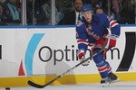UNIONDALE, NY - OCTOBER 11:  Derek Stepan #21 of the New York Rangers skates against the New York Islanders the Nassau Coliseum on October 11, 2010 in Uniondale, New York.  (Photo by Bruce Bennett/Getty Images)