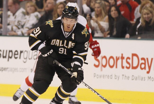 DALLAS - OCTOBER 14: Brad Richards #91 of the Dallas Stars takes the puck in the first period against the Detroit Red Wings on October 14, 2010 at the American Airlines Center in Dallas, Texas.  (Photo by Elsa/Getty Images)
