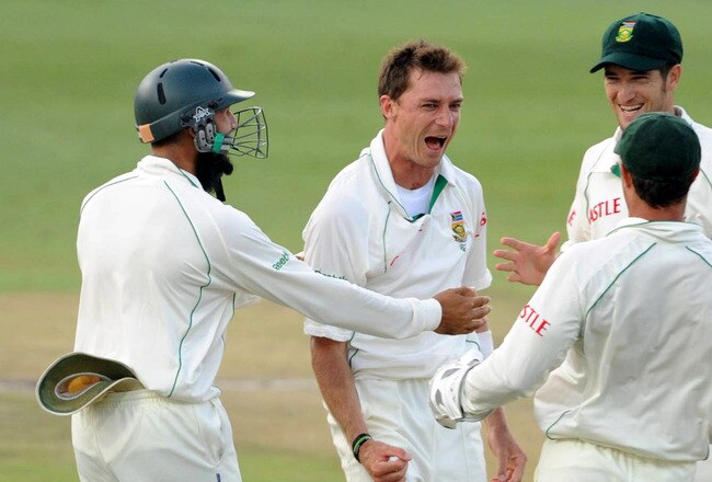 JOHANNESBURG, SOUTH AFRICA - JANUARY 16:  Dale Steyn of South Africa celebrates with team mates the wicket of Jonathan Trott of England during day 3 of the 4th Test match between South Africa and England at the Wanderers cricket ground on January 16, 2010 in Johannesburg, South Africa.  (Photo by Lee Warren/Gallo Images/Getty Images)