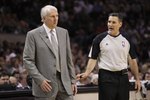 SAN ANTONIO - MAY 09:  Head coach Gregg Popovich of the San Antonio Spurs and referee, Monty McCutchen in Game Four of the Western Conference Semifinals during the 2010 NBA Playoffs at AT&T Center on May 9, 2010 in San Antonio, Texas. NOTE TO USER: User expressly acknowledges and agrees that, by downloading and or using this photograph, User is consenting to the terms and conditions of the Getty Images License Agreement.  (Photo by Ronald Martinez/Getty Images)