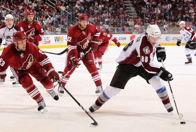 GLENDALE, AZ - MARCH 04:  Peter Mueller #88 of the Colorado Avalanche skates with the puck past Derek Morris #53 and Lee Stempniak #22 of the Phoenix Coyotes during the third period of the NHL game at Jobing.com Arena on March 4, 2010 in Glendale, Arizona. The Coyotes defeated the Avalanche 3-1. (Photo by Christian Petersen/Getty Images)