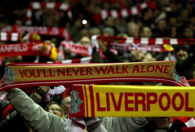 LIVERPOOL, ENGLAND - MARCH 15:  Liverpool fans on the Kop show their support with their scarves during the Barclays Premier League match between Liverpool and Portsmouth at Anfield on March 15, 2010 in Liverpool, England.  (Photo by Alex Livesey/Getty Images)