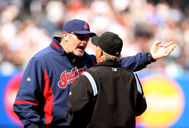 NEW YORK - APRIL 19:  Cleveland Indians manager Eric Wedge argues with the umpire about a Jorge Posada #20 of the New York Yankees pinch hit two-run home run in the seventh inning of their game against the Cleveland Indians at Yankee Stadium on April 19, 2009 in the Bronx borough of New York City.  The hit was reviewed by instant replay, and was ruled a home run.  (Photo by Ezra Shaw/Getty Images)