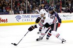 COLUMBUS,OH - October 15:  Viktor Stalberg #25 of the Chicago Blackhawks gets a shot off and beats goaltender Steve Mason #1 of the Columbus Blue Jackets for the first goal of the game during the first period on October 15, 2010 at Nationwide Arena in Columbus, Ohio.  (Photo by John Grieshop/Getty Images)