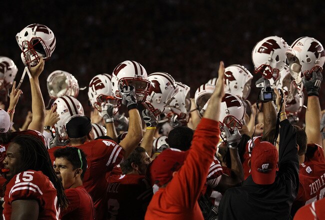 MADISON, WI - OCTOBER 16: Wisconsin Badger players and fans celebrate a win over the Ohio State Buckeyes at Camp Randall Stadium on October 16, 2010 in Madison, Wisconsin. Wisconsin defeated Ohio State 31-18. (Photo by Jonathan Daniel/Getty Images)