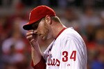 PHILADELPHIA - OCTOBER 16:  Roy Halladay #34 of the Philadelphia Phillies reacts in the sixth inning against the San Francisco Giants in Game One of the NLCS during the 2010 MLB Playoffs at Citizens Bank Park on October 16, 2010 in Philadelphia, Pennsylvania.  (Photo by Jeff Zelevansky/Getty Images)