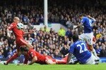LIVERPOOL, ENGLAND - OCTOBER 17:  Tim Cahill (R) of Everton scores the opening goal during the Barclays Premier League match between Everton and Liverpool at Goodison Park on October 17, 2010 in Liverpool, England.  (Photo by Michael Regan/Getty Images)
