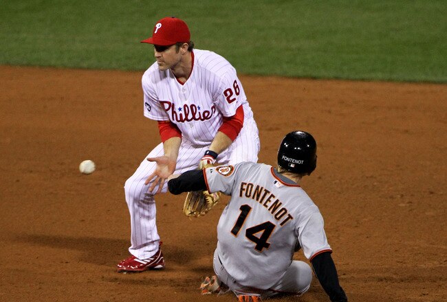PHILADELPHIA - OCTOBER 16:  Mike Fontenot #14 of the San Francisco Giants steals second base in the eighth inning ahead of the tag by Chase Utley #26 of the Philadelphia Phillies in Game One of the NLCS during the 2010 MLB Playoffs at Citizens Bank Park on October 16, 2010 in Philadelphia, Pennsylvania.  (Photo by Doug Pensinger/Getty Images)