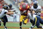 LOS ANGELES, CA - OCTOBER 16:  Allen Bradford #21 of the USC Trojans breaks through a hole in the California Golden Bears defence during the first quarter at Los Angeles Memorial Coliseum on October 16, 2010 in Los Angeles, California.  (Photo by Harry How/Getty Images)