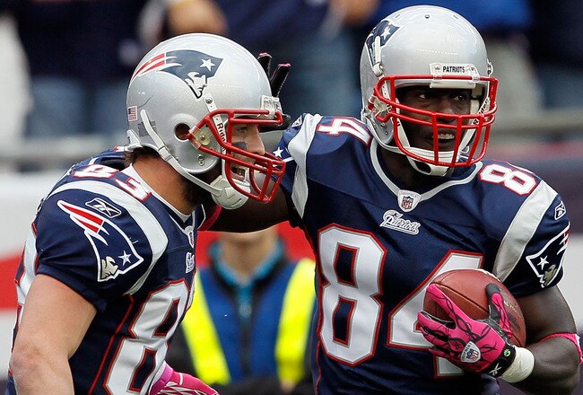 FOXBORO, MA - OCTOBER 17:  Wes Welker #83 celebrate with teammate Deion Branch #84, both of the New England Patriots, after Branch caught a touchdown pass in the second half against the Baltimore Ravens at Gillette Stadium on October 17, 2010 in Foxboro, Massachusetts. The Patriot won 23-20 in overtime.  (Photo by Jim Rogash/Getty Images)