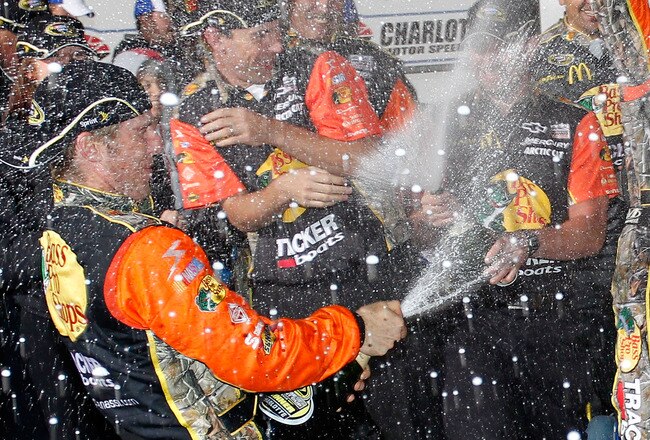 CONCORD, NC - OCTOBER 16:  Jamie McMurray, driver of the #1 Bass Pro Shops/Tracker Boats Chevrolet, celebrates in victory lane after winning  the NASCAR Sprint Cup Series Bank of America 500 at Charlotte Motor Speedway on October 16, 2010 in Concord, North Carolina.  (Photo by Geoff Burke/Getty Images)