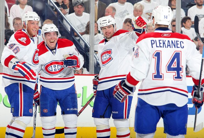 PITTSBURGH - MAY 12:  Mike Cammalleri #13 of the Montreal Canadiens celebrates his second-period goal against the Pittsburgh Penguins with teammates Andrei Kostitsyn #46, Jaroslav Spacek #6 and Tomas Plekanec #14 in Game Seven of the Eastern Conference Semifinals during the 2010 Stanley Cup Playoffs at Mellon Arena on May 12, 2010 in Pittsburgh, Pennsylvania.  (Photo By Dave Sandford/Getty Images)