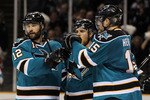 SAN JOSE, CA - MAY 18:  (L) Patrick Marleau #12 of the San Jose Sharks reacts with teammates Joe Pavelski #8 and Dany Heatley #15 after Marleau's third period goal against the Chicago Blackhawks in Game Two of the Western Conference Finals during the 2010 NHL Stanley Cup Playoffs at HP Pavilion on May 18, 2010 in San Jose, California.  (Photo by Jed Jacobsohn/Getty Images)