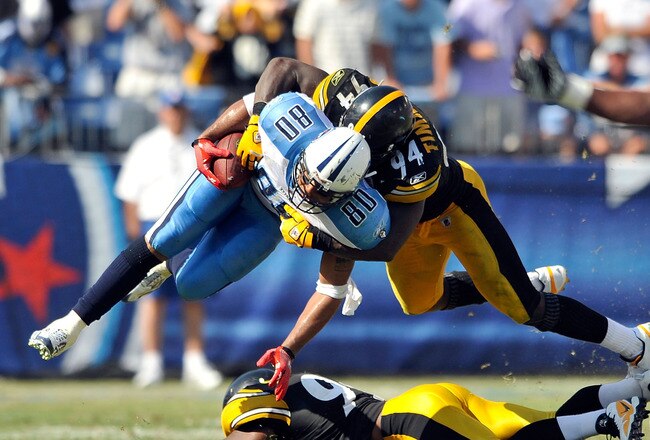 NASHVILLE, TN - SEPTEMBER 19:  Lawrence Timmons #94 of the Pittsburgh Steelers tackles Bo Scaife #80 of the Tennessee Titans at LP Field on September 19, 2010 in Nashville, Tennessee. The Steelers won 19-11.  (Photo by Grant Halverson/Getty Images)