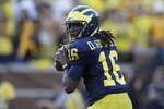 ANN ARBOR, MI - OCTOBER 09:  Denard Robinson #16 of the Michigan Wolverines drops back to pass during the game against the Michigan State Spartans on October 9, 2010 at Michigan Stadium in Ann Arbor, Michigan. The Michigan State Spartans defeated the Michigan Wolvereines 34-17.  (Photo by Leon Halip/Getty Images)