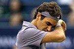 SHANGHAI, CHINA - OCTOBER 17:  Roger Federer of Switzerland wipes his forehead between points while playing Andy Murray of Great Britain during the final on day seven of the 2010 Shanghai Rolex Masters at the Shanghai Qi Zhong Tennis Center on October 17, 2010 in Shanghai, China.  (Photo by Matthew Stockman/Getty Images)