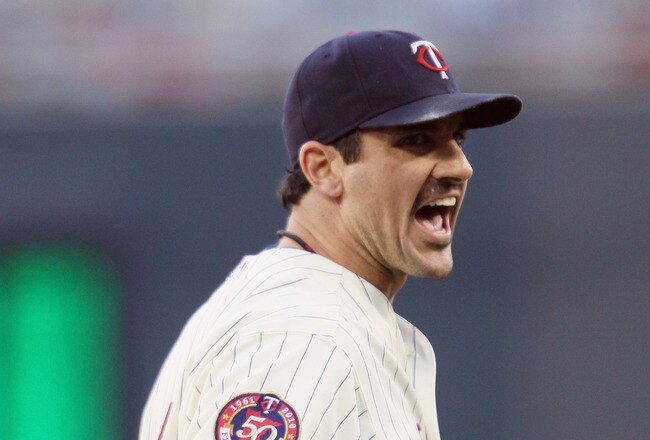 MINNEAPOLIS - OCTOBER 07:  Carl Pavano #48 of the Minnesota Twins celebrates after the third out in the first inning against the New York Yankees during game two of the ALDS on October 7, 2010 at Target Field in Minneapolis, Minnesota.  (Photo by Elsa/Getty Images)