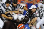 GAINESVILLE, FL - OCTOBER 16:  SEC officials pull players from a fumble pile as the Florida Gators host the Mississippi State Bulldogs October 16, 2010 Ben Hill Griffin Stadium at Gainesville, Florida.  The Bulldogs won 10 - 7. (Photo by Al Messerschmidt/Getty Images)