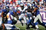 EAST RUTHERFORD, NJ - OCTOBER 17: Kevin Smith #34 of the Detroit Lions runs the ball against the New York Giants at New Meadowlands Stadium on October 17, 2010 in East Rutherford, New Jersey. The Giants defeated the Lions 28 - 20. (Photo by Andrew Burton/Getty Images)