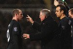 LONDON, ENGLAND - DECEMBER 05:  Sir Alex Ferguson manager of Manchester United talsk to Wayne Rooney during the Barclays Premier League match between West Ham United and Manchester United at Upton Park on December 5, 2009 in London, England.  (Photo by Richard Heathcote/Getty Images)