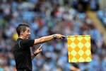 COVENTRY, ENGLAND - AUGUST 07:  A referees assistant signals an offside during the npower Championship match between Coventry City and Portsmouth at the Ricoh Arena on August 7, 2010 in Coventry, England.  (Photo by David Rogers/Getty Images)