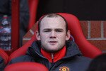 MANCHESTER, ENGLAND - OCTOBER 16:  Wayne Rooney of Manchester United looks on from the bench prior to the Barclays Premier League match between Manchester United and West Bromwich Albion at Old Trafford on October 16, 2010 in Manchester, England.  (Photo by Alex Livesey/Getty Images)