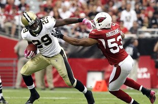 GLENDALE, AZ - OCTOBER 10:  Runningback Chris Ivory #29 of the New Orleans Saints runs with the football past Clark Haggans #53 of the Arizona Cardinals during the NFL game at the University of Phoenix Stadium on October 10, 2010 in Glendale, Arizona.  The Cardinals defeated the Saints 30-20. (Photo by Christian Petersen/Getty Images)