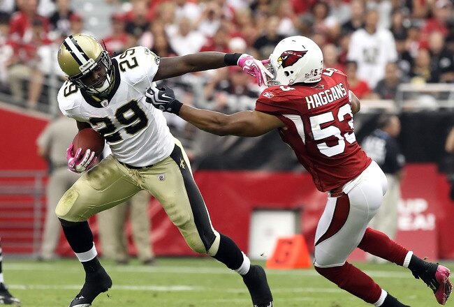 GLENDALE, AZ - OCTOBER 10:  Runningback Chris Ivory #29 of the New Orleans Saints runs with the football past Clark Haggans #53 of the Arizona Cardinals during the NFL game at the University of Phoenix Stadium on October 10, 2010 in Glendale, Arizona.  The Cardinals defeated the Saints 30-20. (Photo by Christian Petersen/Getty Images)