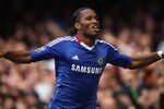 LONDON, ENGLAND - OCTOBER 03:  Didier Drogba of Chelsea celebrates scoring during the Barclays Premier League match between Chelsea and Arsenal at Stamford Bridge on October 3, 2010 in London, England.  (Photo by Bryn Lennon/Getty Images)