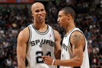 SAN ANTONIO - APRIL 25:  Forward Richard Jefferson #24 and George Hill #3 of the San Antonio Spurs react during a 92-89 win against the Dallas Mavericks in Game Four of the Western Conference Quarterfinals during the 2010 NBA Playoffs at AT&T Center on April 25, 2010 in San Antonio, Texas. NOTE TO USER: User expressly acknowledges and agrees that, by downloading and or using this photograph, User is consenting to the terms and conditions of the Getty Images License Agreement.  (Photo by Ronald Martinez/Getty Images)